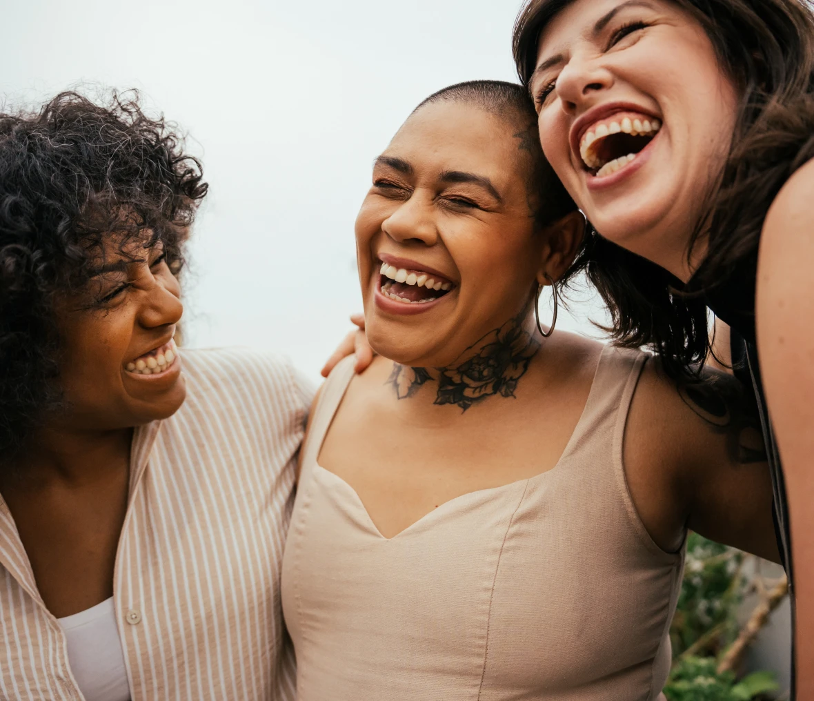 Friends laughing together outdoors